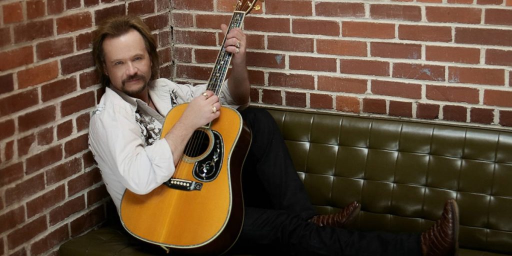 Travis Tritt Playing the guitar