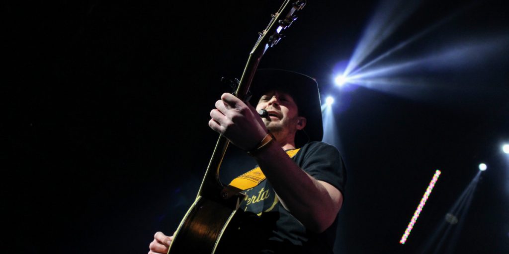 Paul Brandt playing guitar in Edmonton.