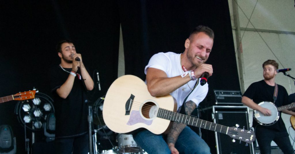 Justin Tyler performing at Boots & Hearts