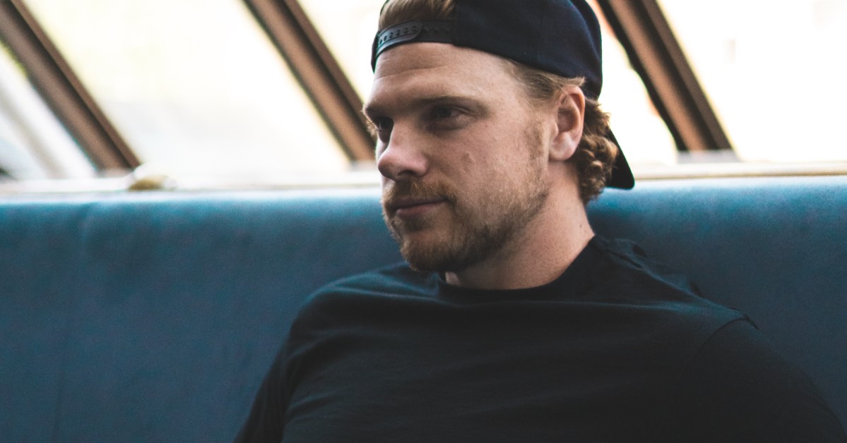 Greg Rider's sitting on a bench