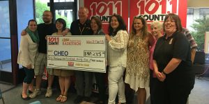 Country 101.1 Radiothon for CHEO holding cheque for over $40,000