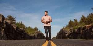 Canadian Country Artist Don Amero walking down the road