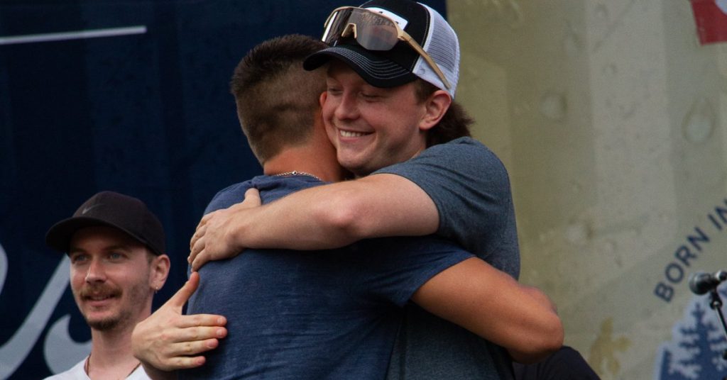 Riley Taylor and Andy Bast hug