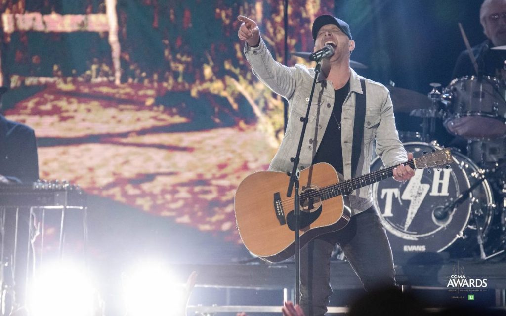 Tim Hicks performing on the stage at the 2021 CCMA Awards