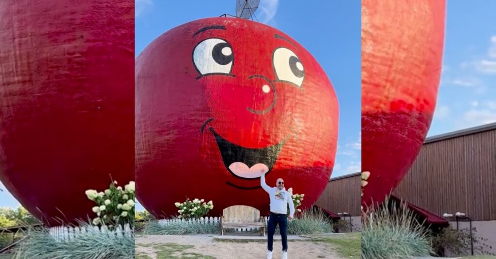 Logan Miller jumping in front of the Big Apple along the highway 401 in Colbourne Ontario.