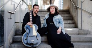 Country Duo Amanda and James sitting on stairs